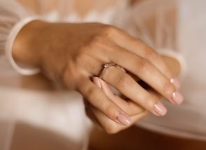 woman-with-engagement-ring-with-diamond-beautiful-manicure_8353-10434